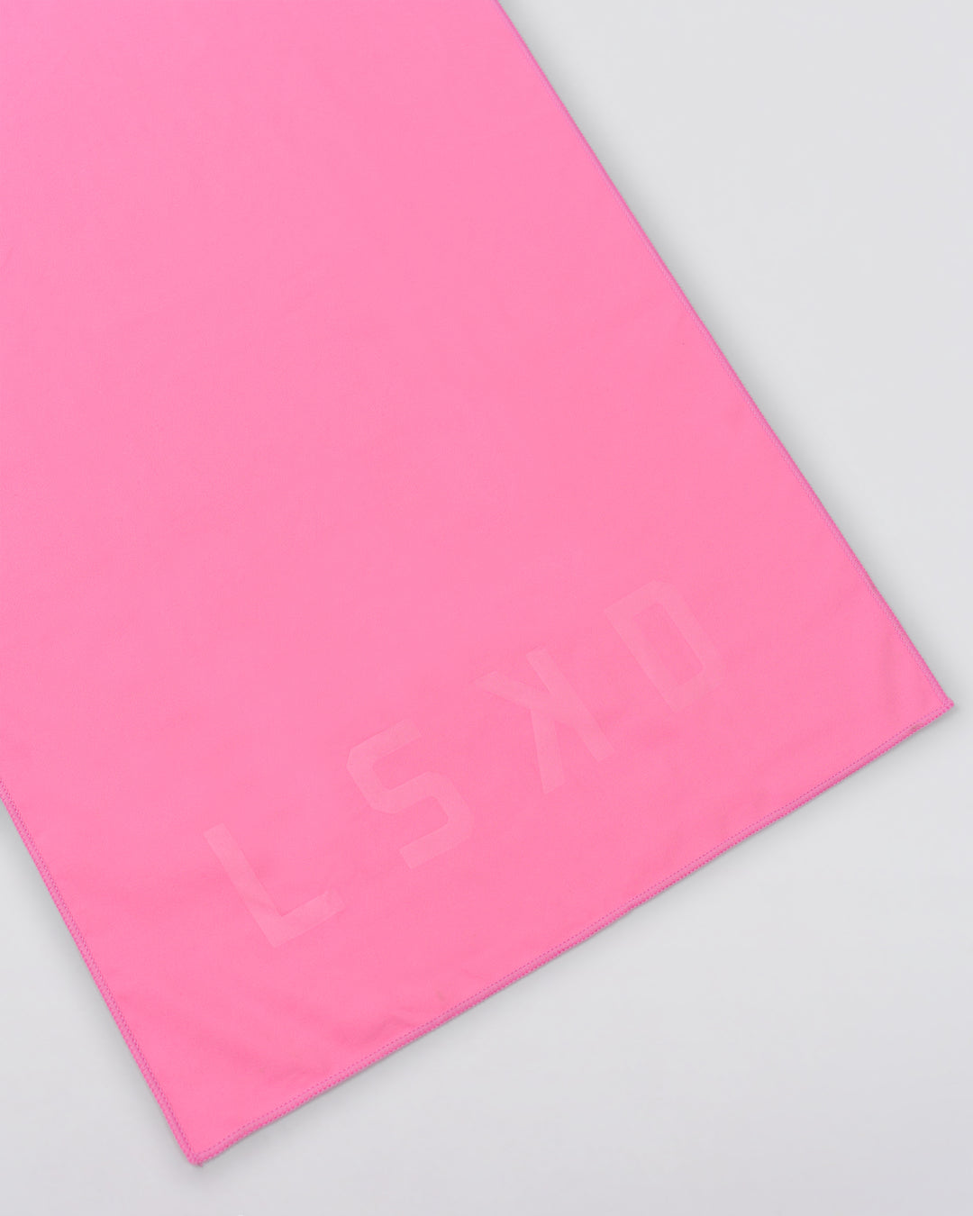 Studio image of Perform Microfibre Lightweight Towel Medium - Pink Rose - view 4