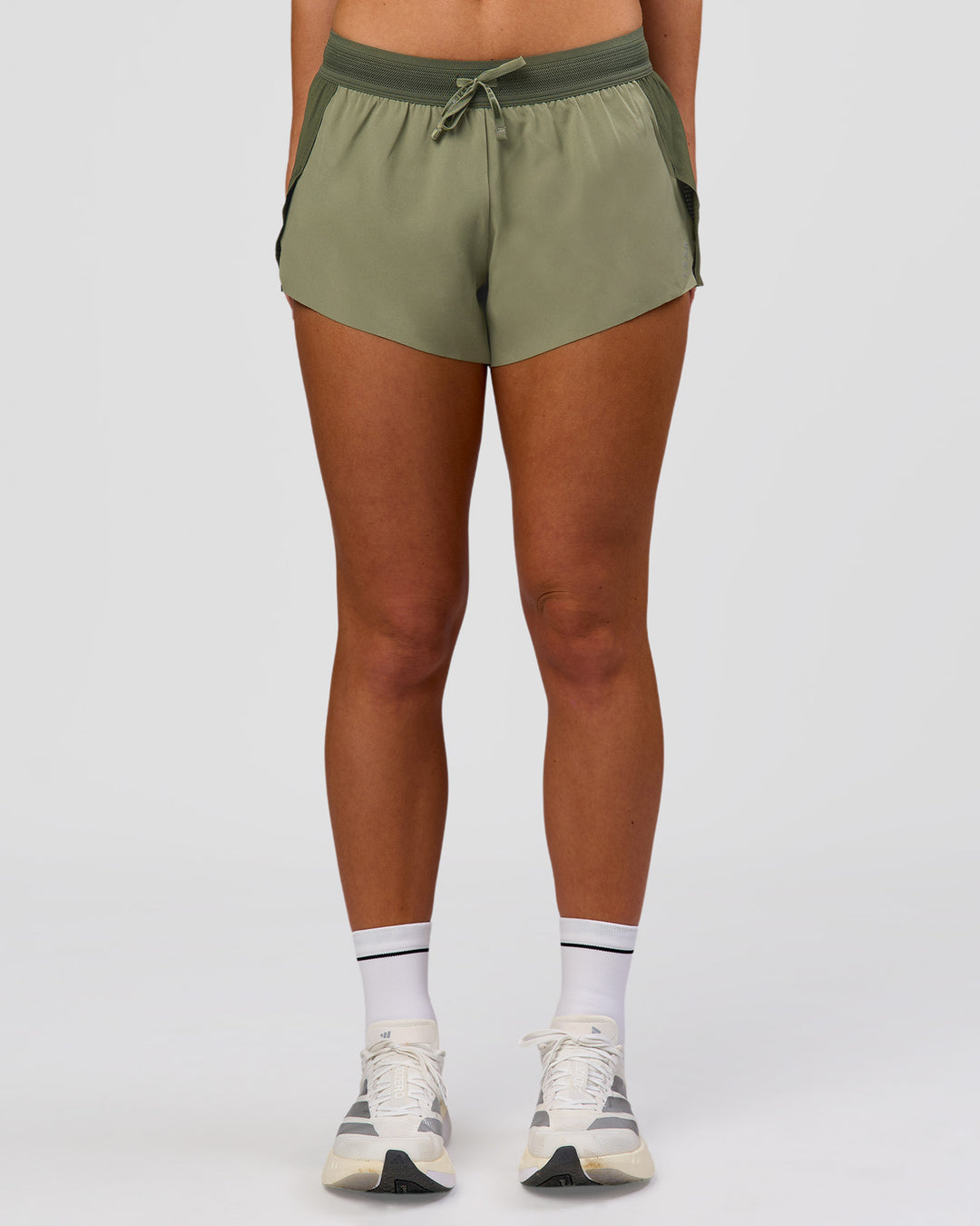 Woman wearing Accelerate 3" Mid-Rise Running Short - Pure Olive-Fog | Model:Xs | Size:ISSY - view 6