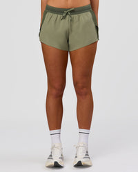 Woman wearing Accelerate 3" Mid-Rise Running Short - Pure Olive-Fog | Model:Xs | Size:ISSY | Thumbnail Index: 5