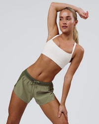 Woman wearing Accelerate 3" Mid-Rise Running Short - Pure Olive-Fog | Model:Xs | Size:ISSY | Thumbnail Index: 13
