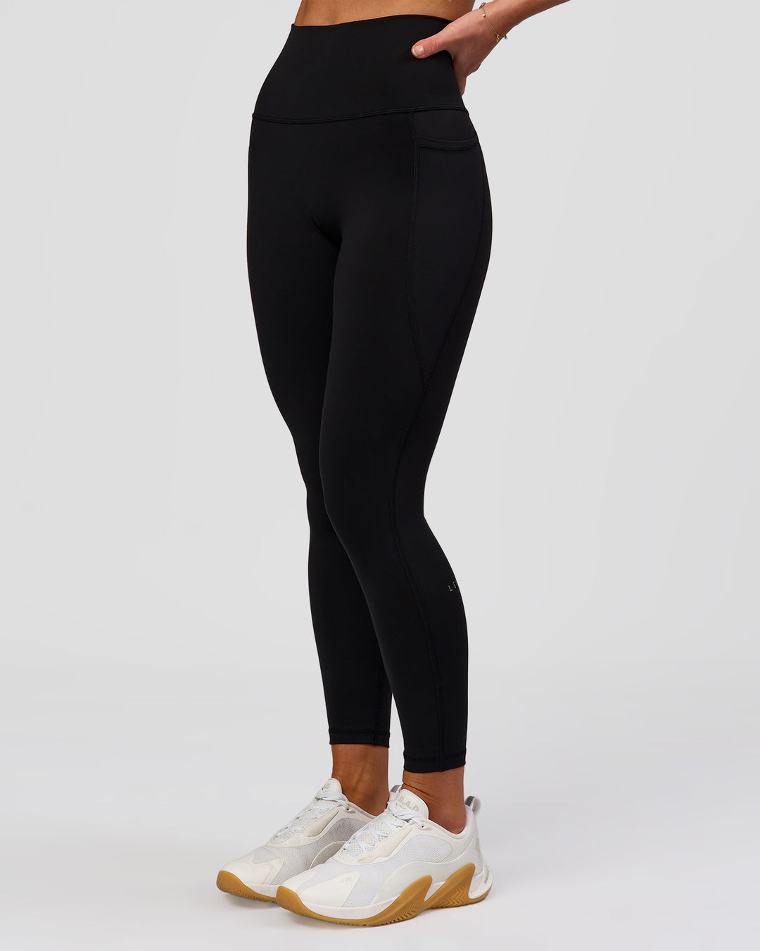 Woman wearing Fusion O.G Ultra High-Rise 7/8 Legging Pockets - Black | Model:Issy| Size:XS - view 4