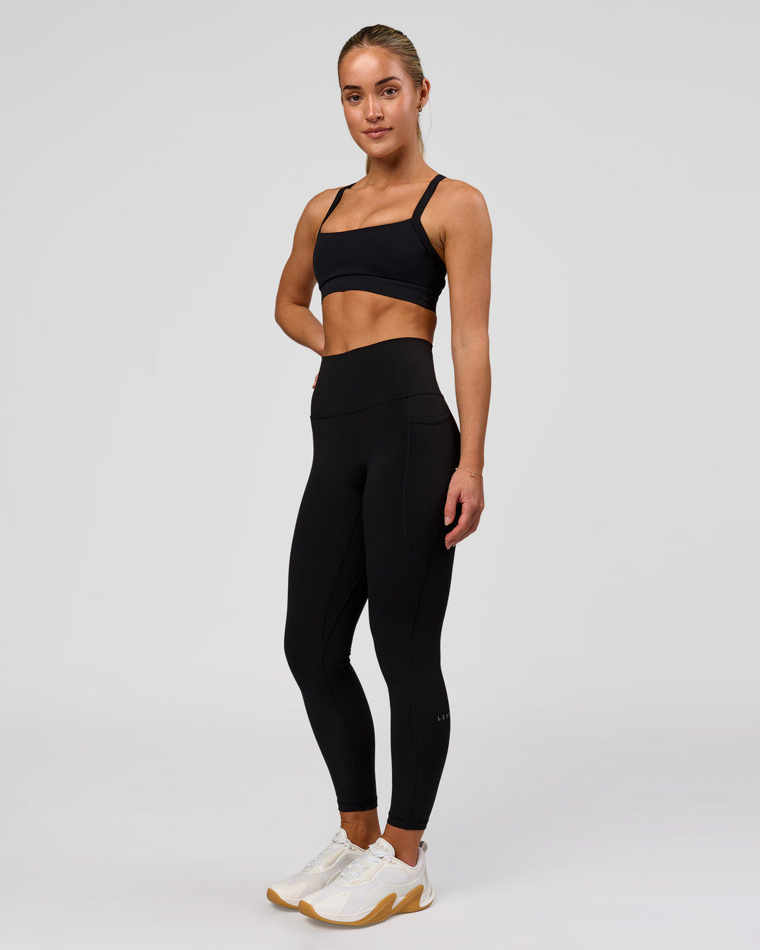Woman wearing Fusion O.G Ultra High-Rise 7/8 Legging Pockets - Black | Model:Xs | Size:ISSY - view 5