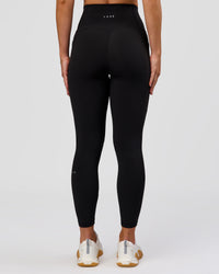 Woman wearing Fusion O.G Ultra High-Rise 7/8 Legging Pockets - Black | Model:Xs | Size:ISSY | Thumbnail Index: 5