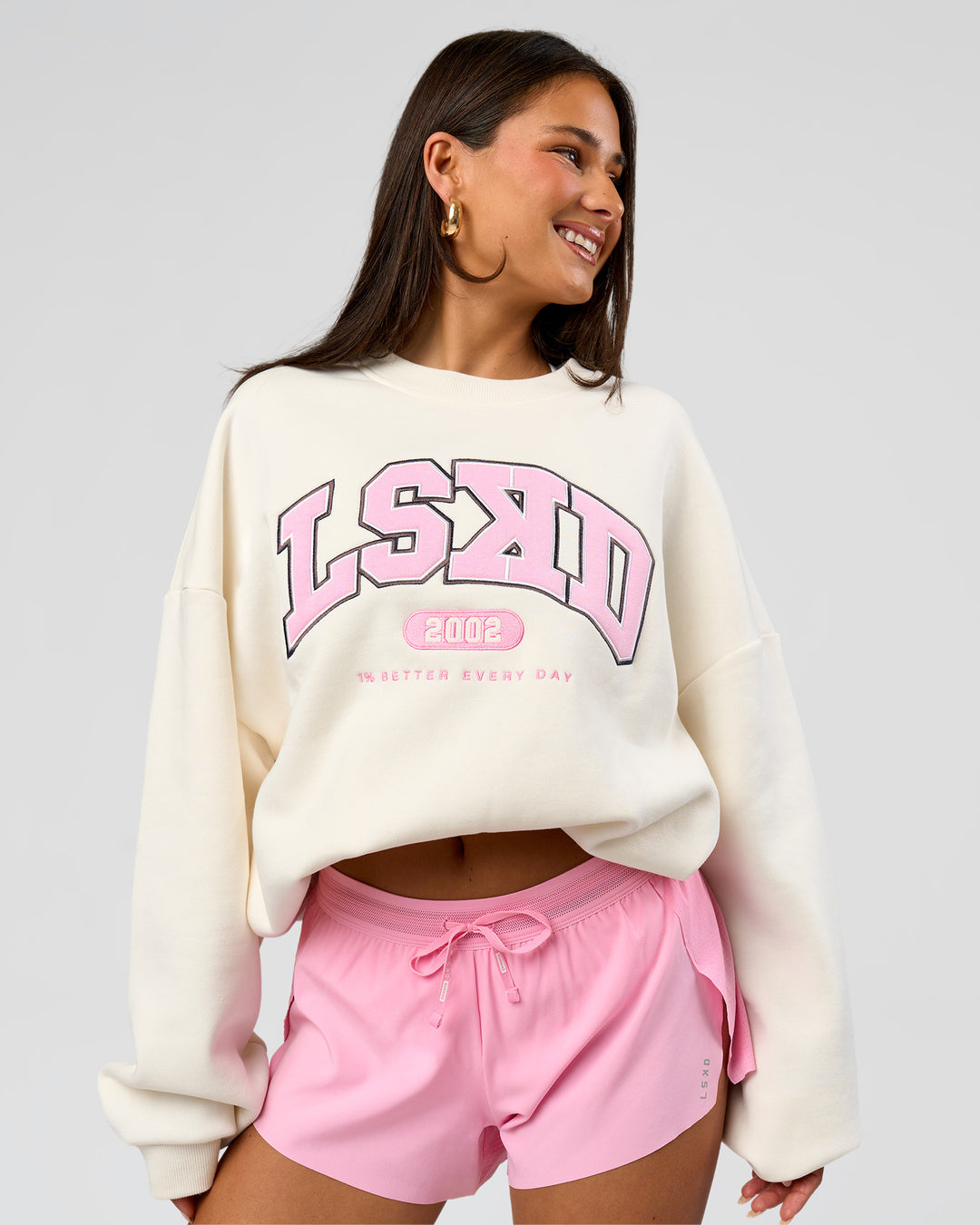 Woman wearing Varsity Boxy Crew - Off White-Pink Rose | Model:Bianca | Size:L - view 7
