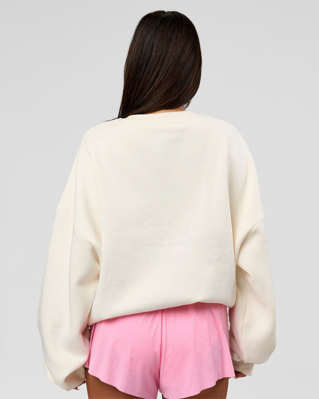 Woman wearing Varsity Boxy Crew - Off White-Pink Rose | Model:Bianca | Size:L - view 13