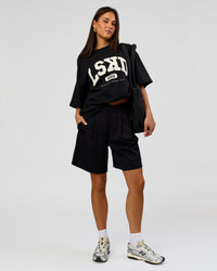 Woman wearing Varsity EST Heavyweight Oversized Tee  - Black-Off White | Model:Bianca | Size:L | Thumbnail Index: 10