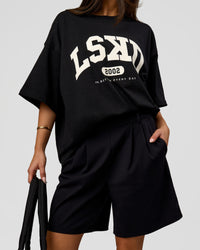Woman wearing Varsity EST Heavyweight Oversized Tee  - Black-Off White | Model:Bianca | Size:L | Thumbnail Index: 12