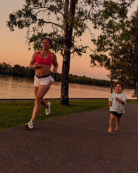 Woman wearing Accelerate 3" Mid-Rise Running Short - White-Future Navy | Model:Tia | Size:M | Thumbnail Index: 15