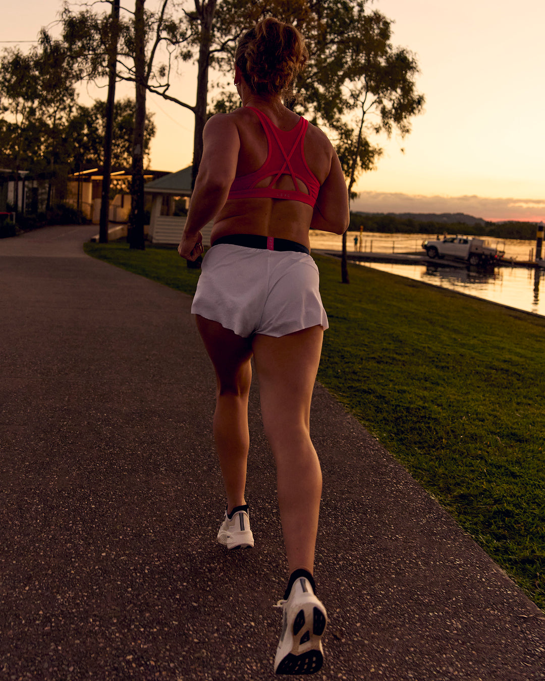 Woman wearing Accelerate 3" Mid-Rise Running Short - White-Future Navy | Model:Tia | Size:M - view 15
