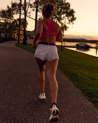 Woman wearing Accelerate 3" Mid-Rise Running Short - White-Future Navy | Model:Tia | Size:M | Thumbnail Index: 14