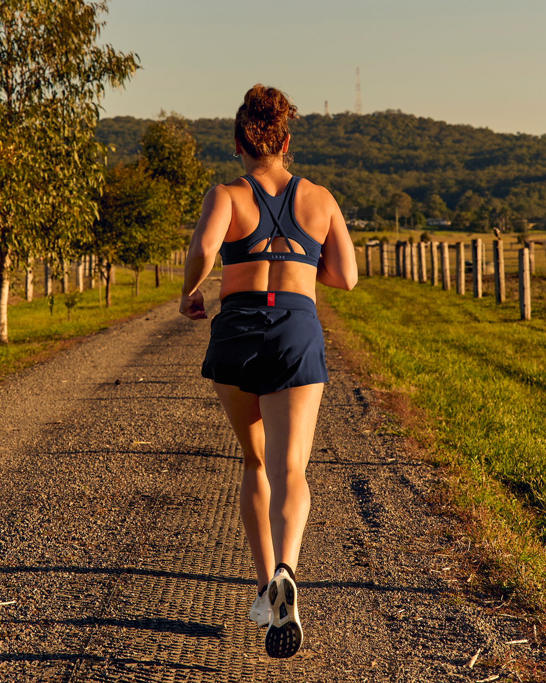 Woman wearing Tia-Clair Toomey-Orr Accelerate 3" Storage Running Short - Future Navy | Model:Tia | Size:M - view 17