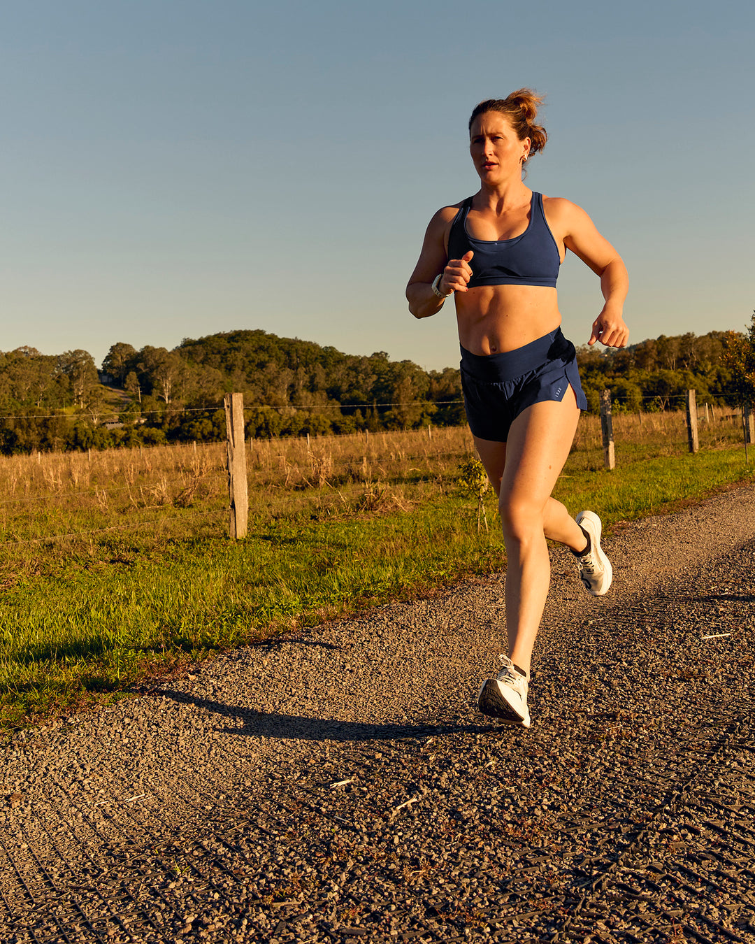 Woman wearing Tia-Clair Toomey-Orr Accelerate 3" Storage Running Short - Future Navy | Model:Tia | Size:M - view 16
