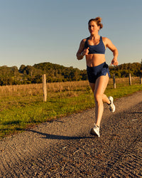 Woman wearing Tia-Clair Toomey-Orr Accelerate 3" Storage Running Short - Future Navy | Model:Tia | Size:M | Thumbnail Index: 15