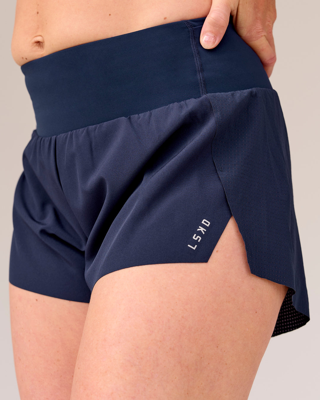 Woman wearing Tia-Clair Toomey-Orr Accelerate 3" Storage Running Short - Future Navy | Model:Tia | Size:M - view 14