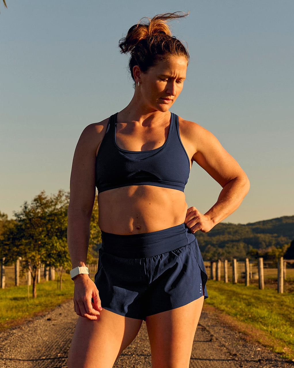 Woman wearing Tia-Clair Toomey-Orr Accelerate 3" Storage Running Short - Future Navy | Model:Tia | Size:M - view 12