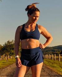 Woman wearing Tia-Clair Toomey-Orr Accelerate 3" Storage Running Short - Future Navy | Model:Tia | Size:M | Thumbnail Index: 11