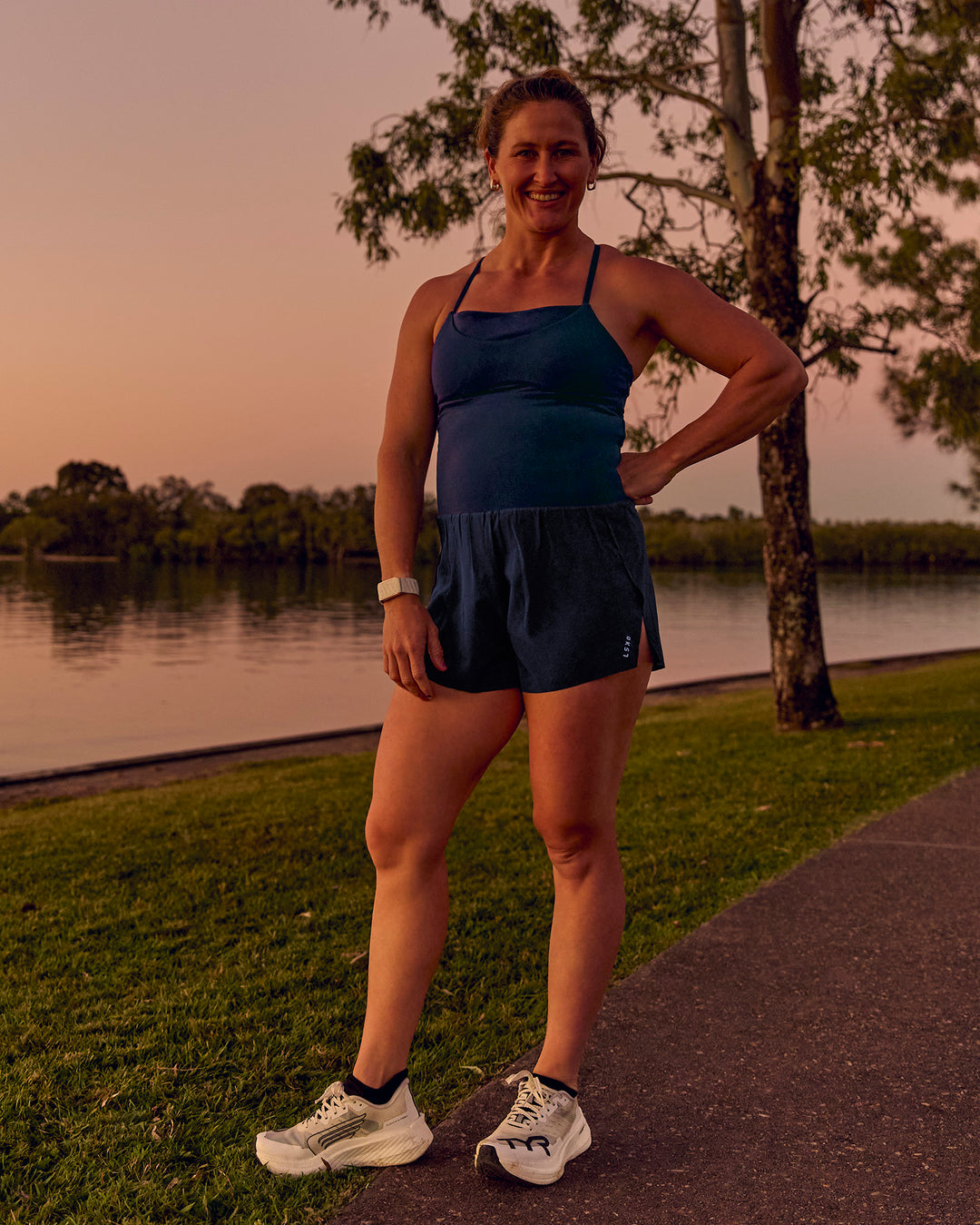 Woman wearing Tia-Clair Toomey-Orr Legacy 3" Run One-Piece - Future Navy | Model:Tia | Size:M - view 23