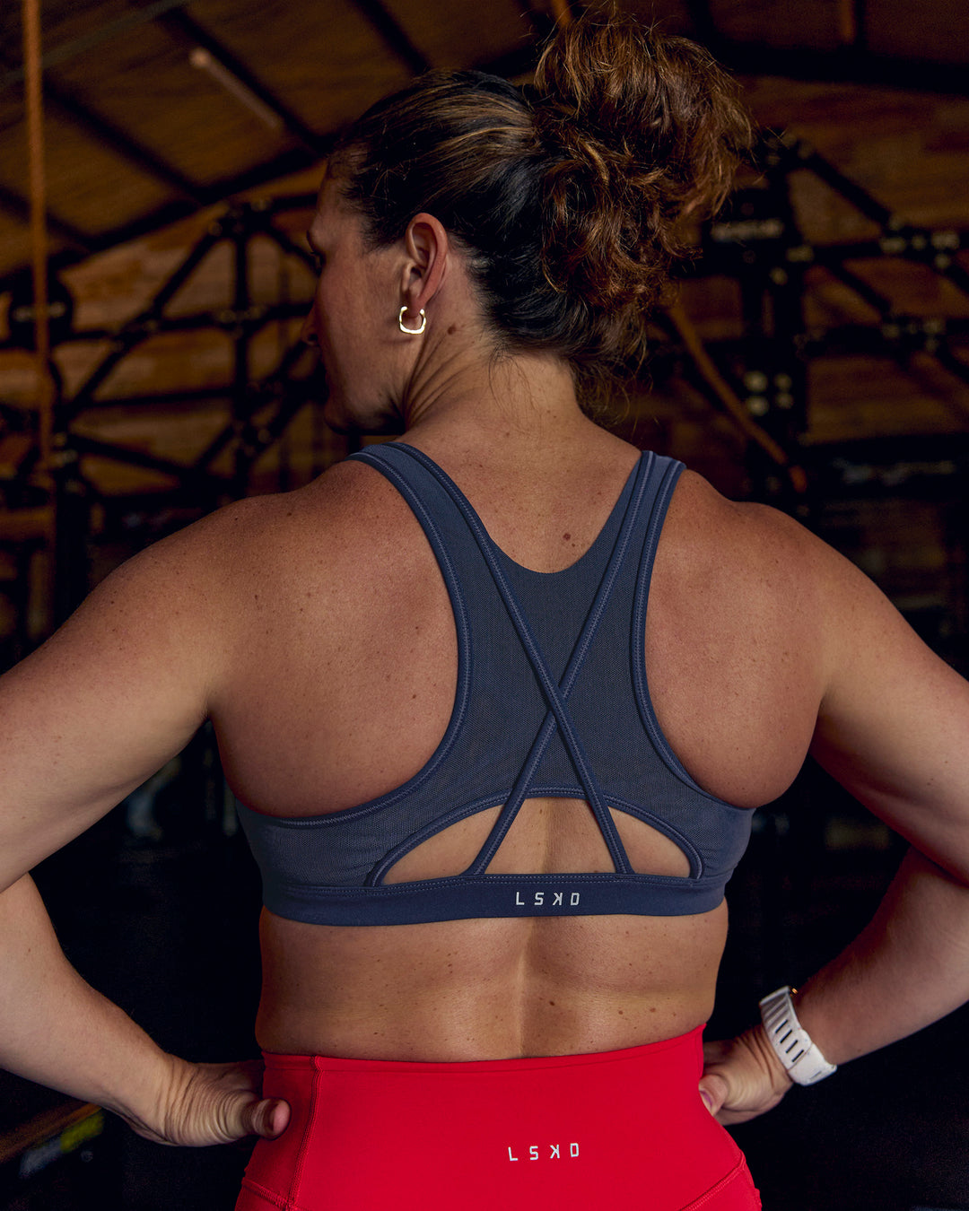 Woman wearing Unstoppable Racerback Sports Bra - Future Navy | Model:Tia | Size:M - view 5