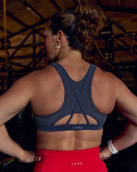 Woman wearing Unstoppable Racerback Sports Bra - Future Navy | Model:Tia | Size:M | Thumbnail Index: 4
