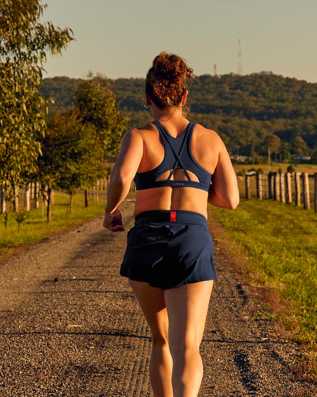 Woman wearing Unstoppable Racerback Sports Bra - Future Navy | Model:Tia | Size:M - view 8
