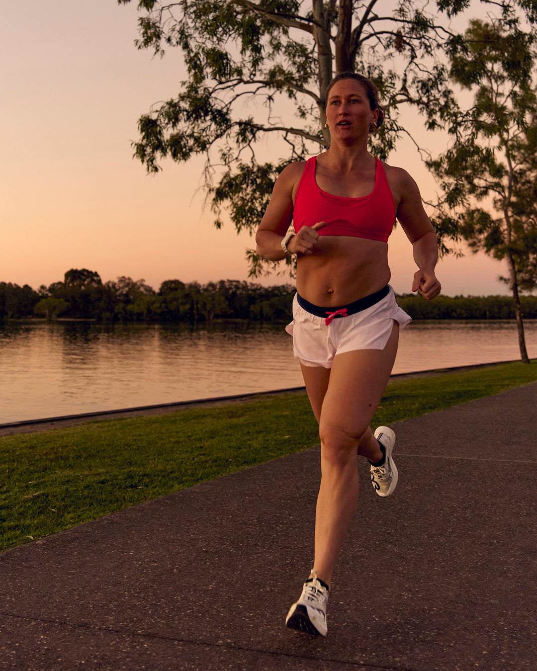 Woman wearing Unstoppable Racerback Sports Bra - Scarlet | Model:Tia | Size:M - view 15