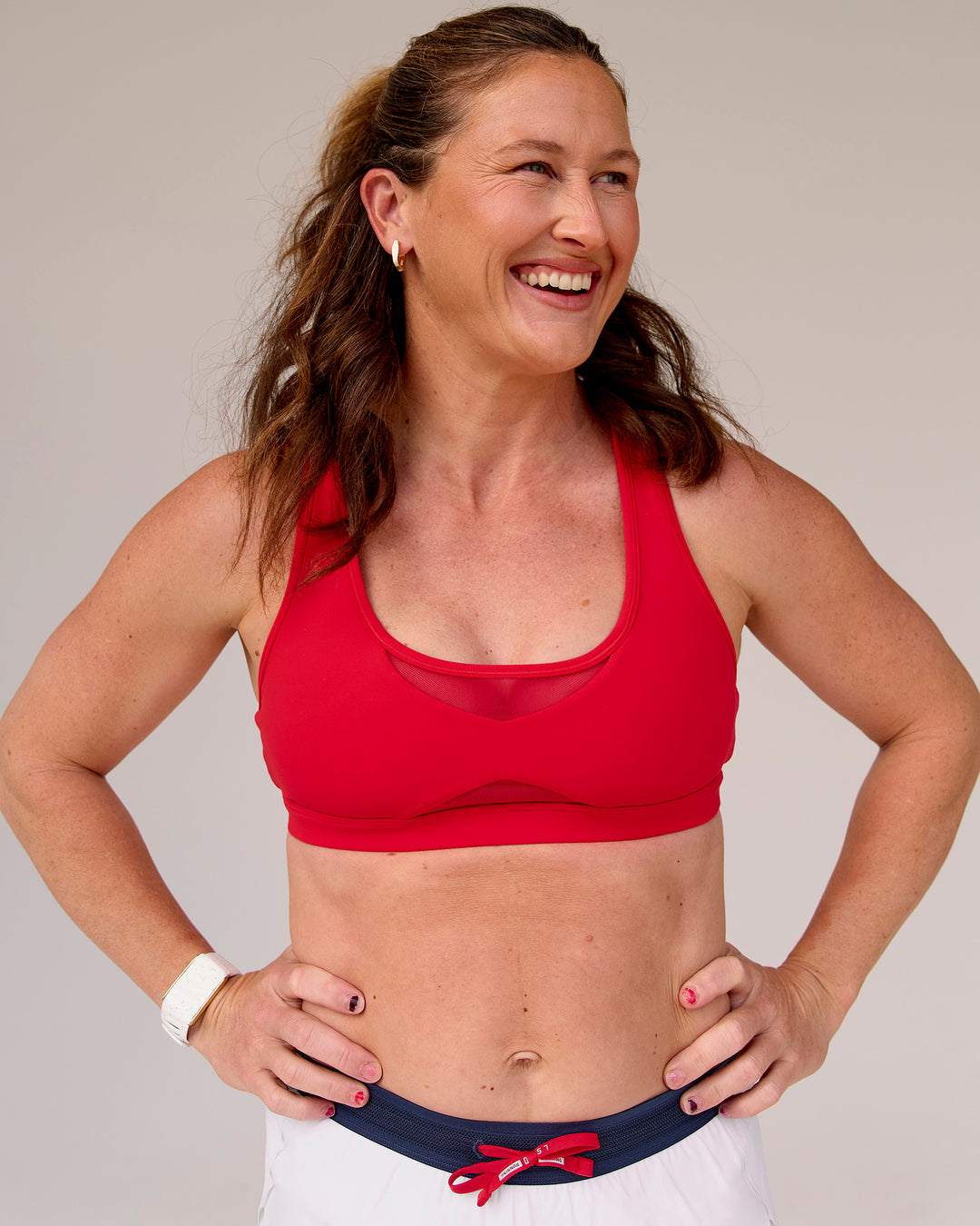 Woman wearing Unstoppable Racerback Sports Bra - Scarlet | Model:Tia | Size:M - view 10