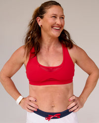 Woman wearing Unstoppable Racerback Sports Bra - Scarlet | Model:Tia | Size:M | Thumbnail Index: 9