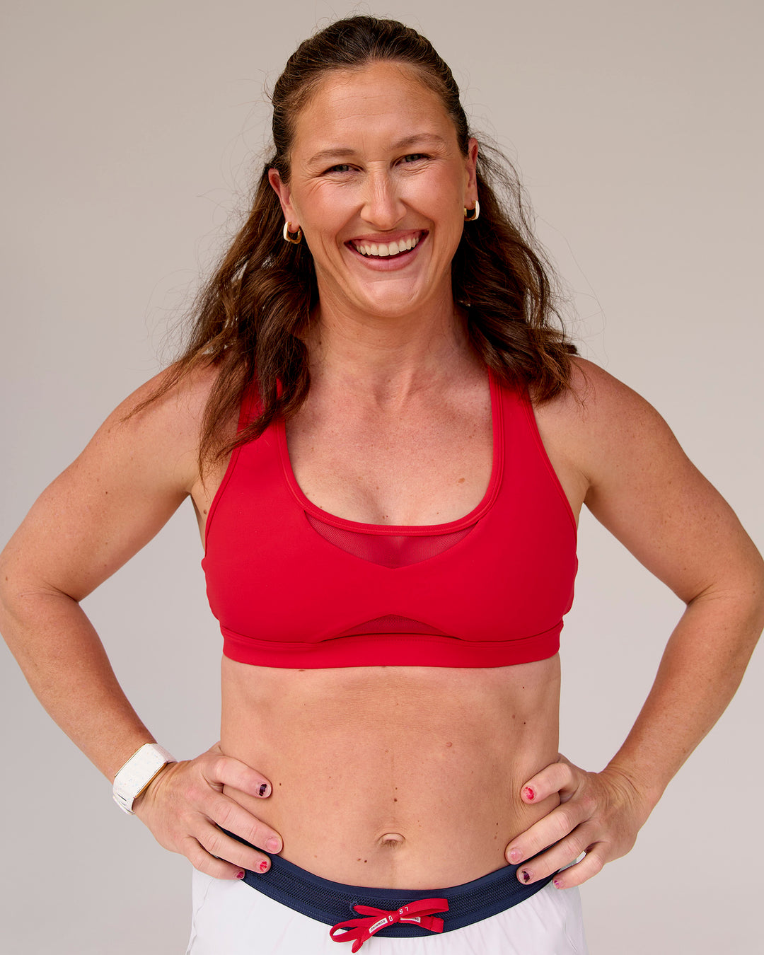 Woman wearing Unstoppable Racerback Sports Bra - Scarlet | Model:Tia | Size:M - view 7