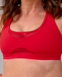 Woman wearing Unstoppable Racerback Sports Bra - Scarlet | Model:Tia | Size:M | Thumbnail Index: 7