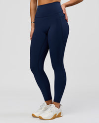 Woman wearing O.G. Fusion Ultra High-Rise Full Length Legging Pockets - Future Navy | Model:Amity| Size:S | Thumbnail Index: 1