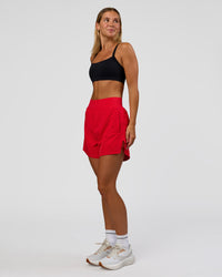 Woman wearing Challenger 5" Lined Performance Short - Scarlet | Model:Amity | Size:S | Thumbnail Index: 2