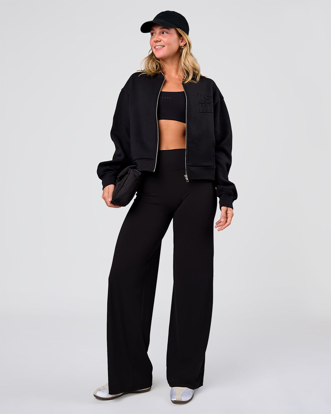 Woman wearing Elixir High-Rise Pant - Black | Model:Amity | Size:S - view 7