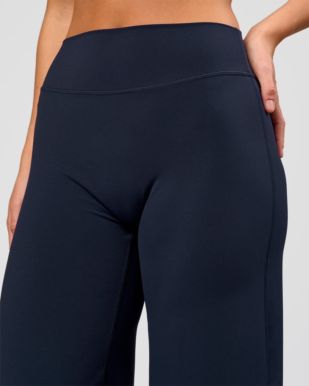 Woman wearing Elixir High-Rise Pant - Midnight Navy | Model:Amity | Size:S - view 8