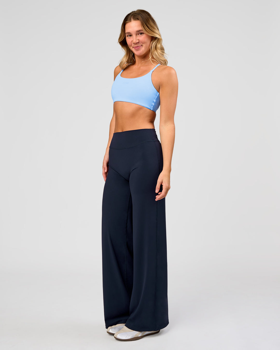 Woman wearing Elixir High-Rise Pant - Midnight Navy | Model:Amity | Size:S - view 9