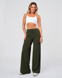 Woman wearing Elixir High-Rise Pant - Pure Olive | Model:Amity | Size:S | Thumbnail Index: 1