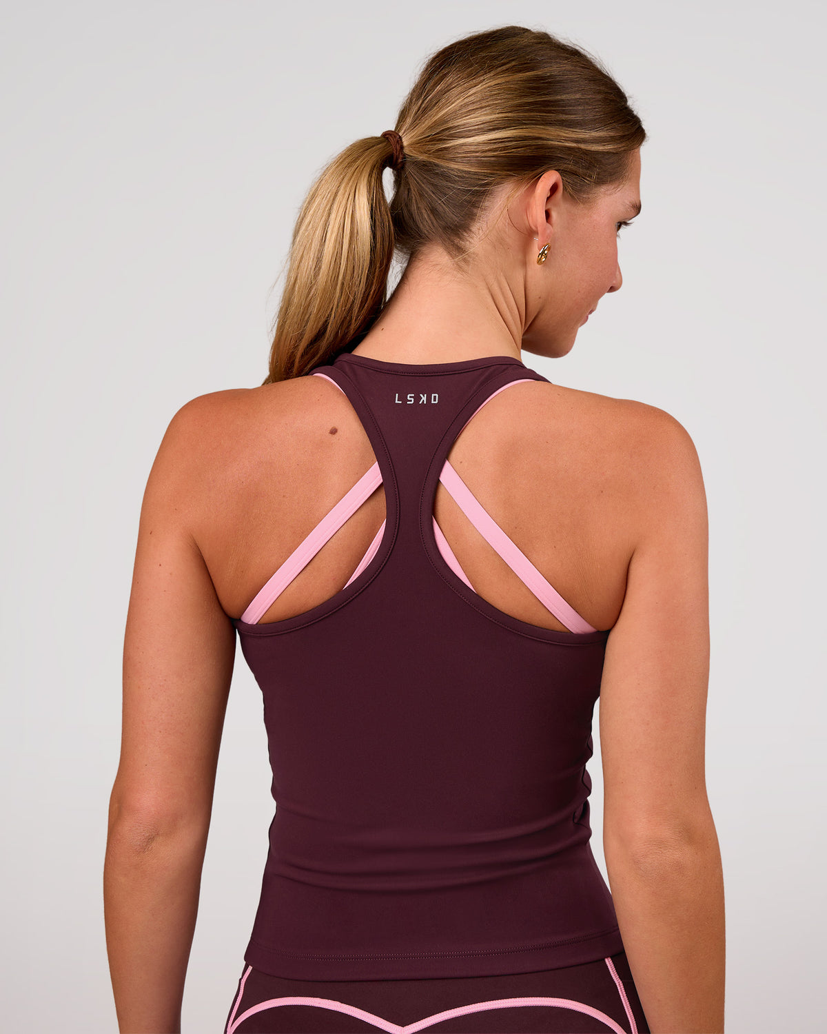 Woman wearing Flow Rep Scoop Neck Tank - Cherry Lacquer | Model:Amity | Size:S