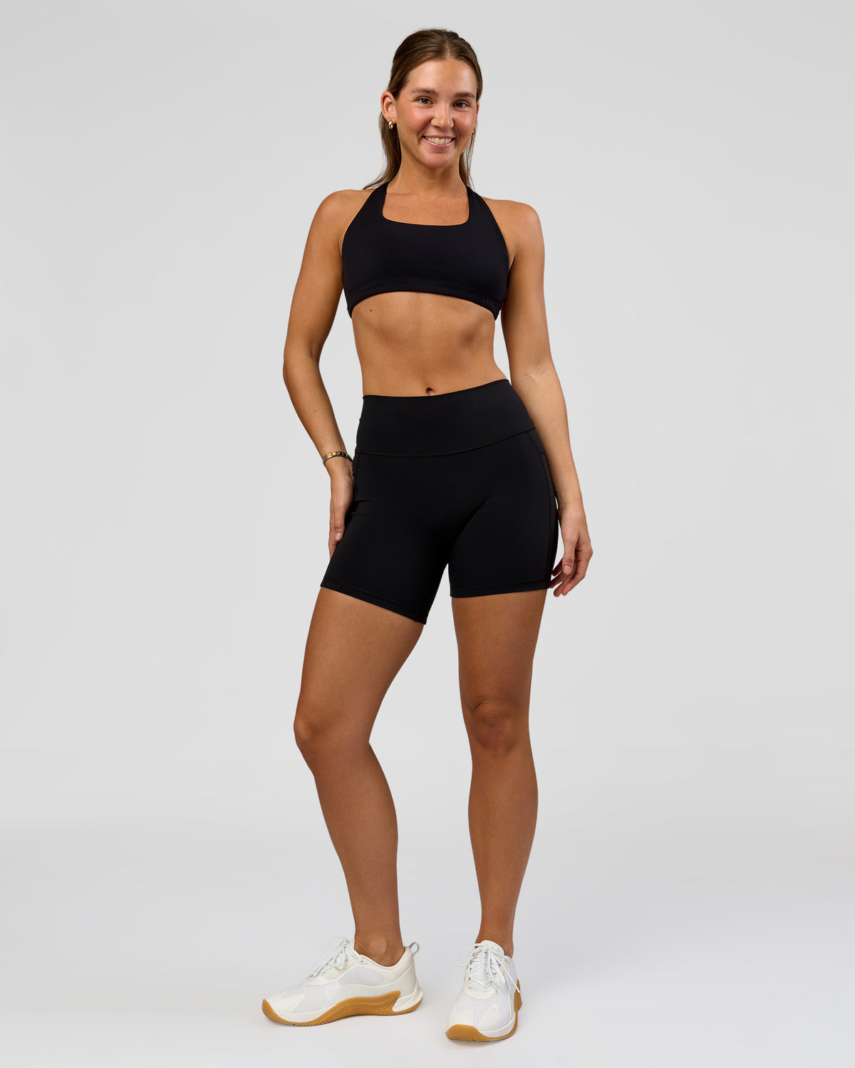 Woman wearing O.G. Fusion High-Rise 6" Short Pockets - Black | Model:Amity | Size:S