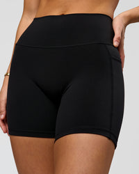 Woman wearing O.G. Fusion High-Rise 6" Short Pockets - Black | Model:Amity | Size:S | Thumbnail Index: 0