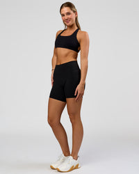 Woman wearing O.G. Fusion High-Rise 6" Short Pockets - Black | Model:Amity | Size:S | Thumbnail Index: 5