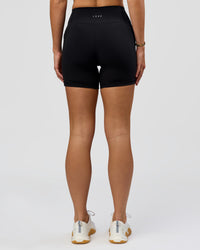 Woman wearing O.G. Fusion High-Rise 6" Short Pockets - Black | Model:Amity | Size:S | Thumbnail Index: 9