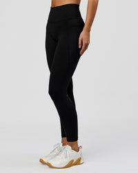 Woman wearing O.G. Fusion High-Rise Full Length Legging Pockets - Black | Model:Amity | Size:S | Thumbnail Index: 6