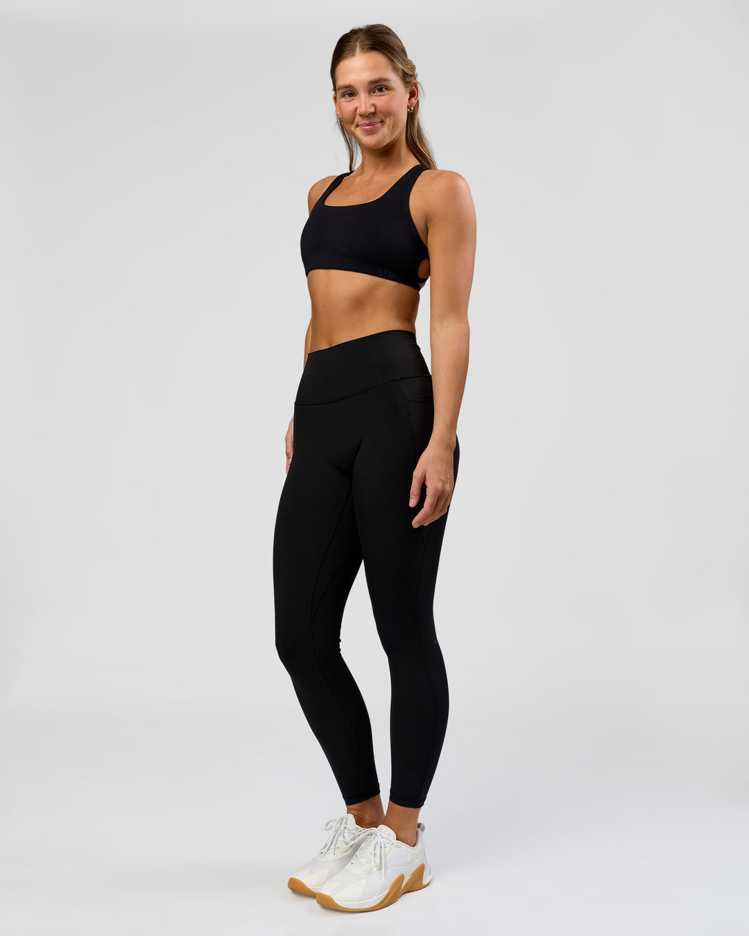 Woman wearing O.G. Fusion High-Rise Full Length Legging Pockets - Black | Model:Amity | Size:S - view 9