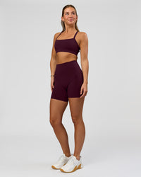 Woman wearing O.G. Fusion Ultra High-Rise 6" Short Pockets - Cherry Lacquer | Model:Amity | Size:S | Thumbnail Index: 2