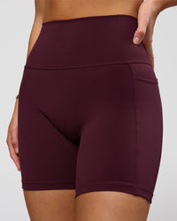 Woman wearing O.G. Fusion Ultra High-Rise 6" Short Pockets - Cherry Lacquer | Model:Amity | Size:S | Thumbnail Index: 0