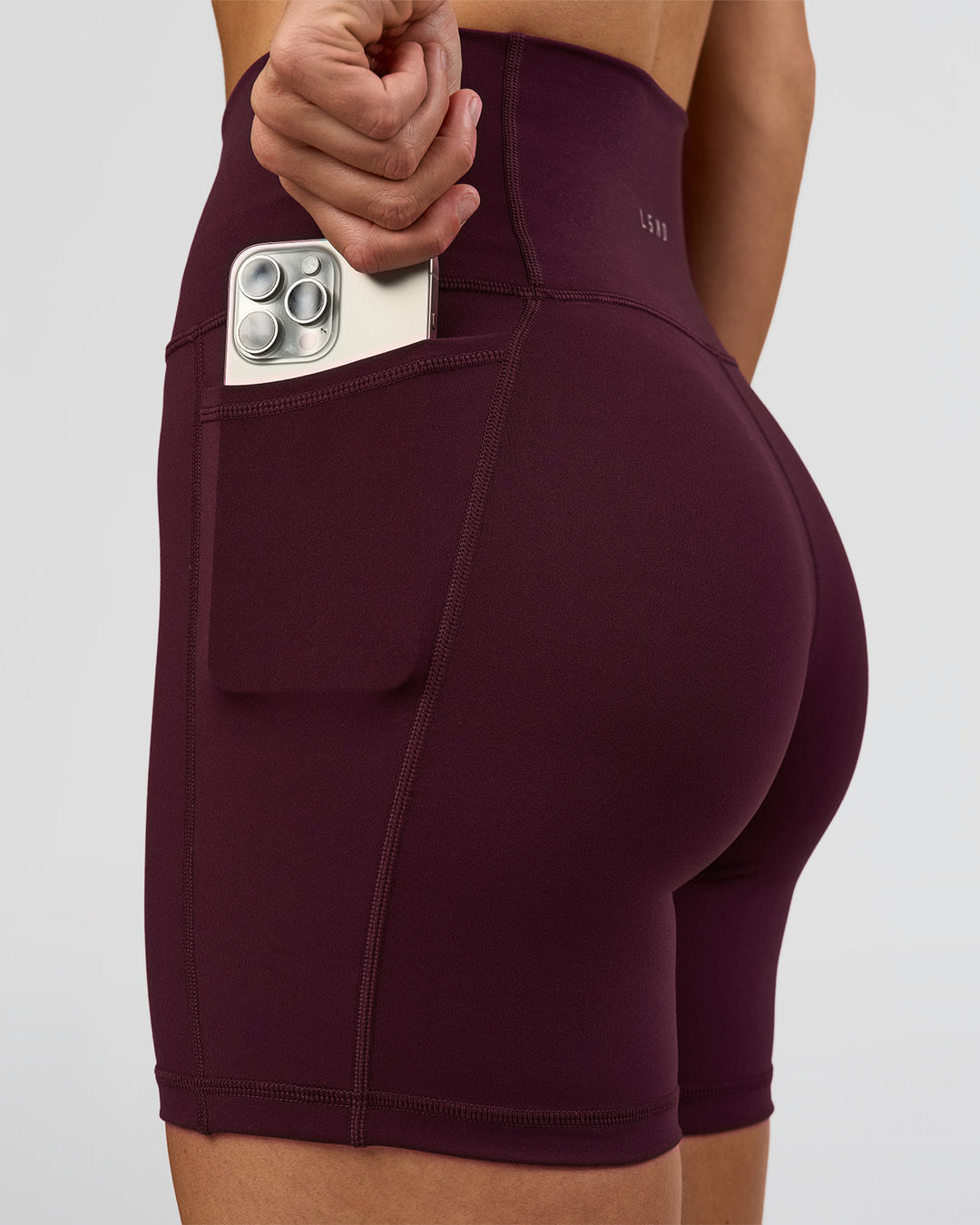 Woman wearing O.G. Fusion Ultra High-Rise 6" Short Pockets - Cherry Lacquer | Model:Amity | Size:S - view 5