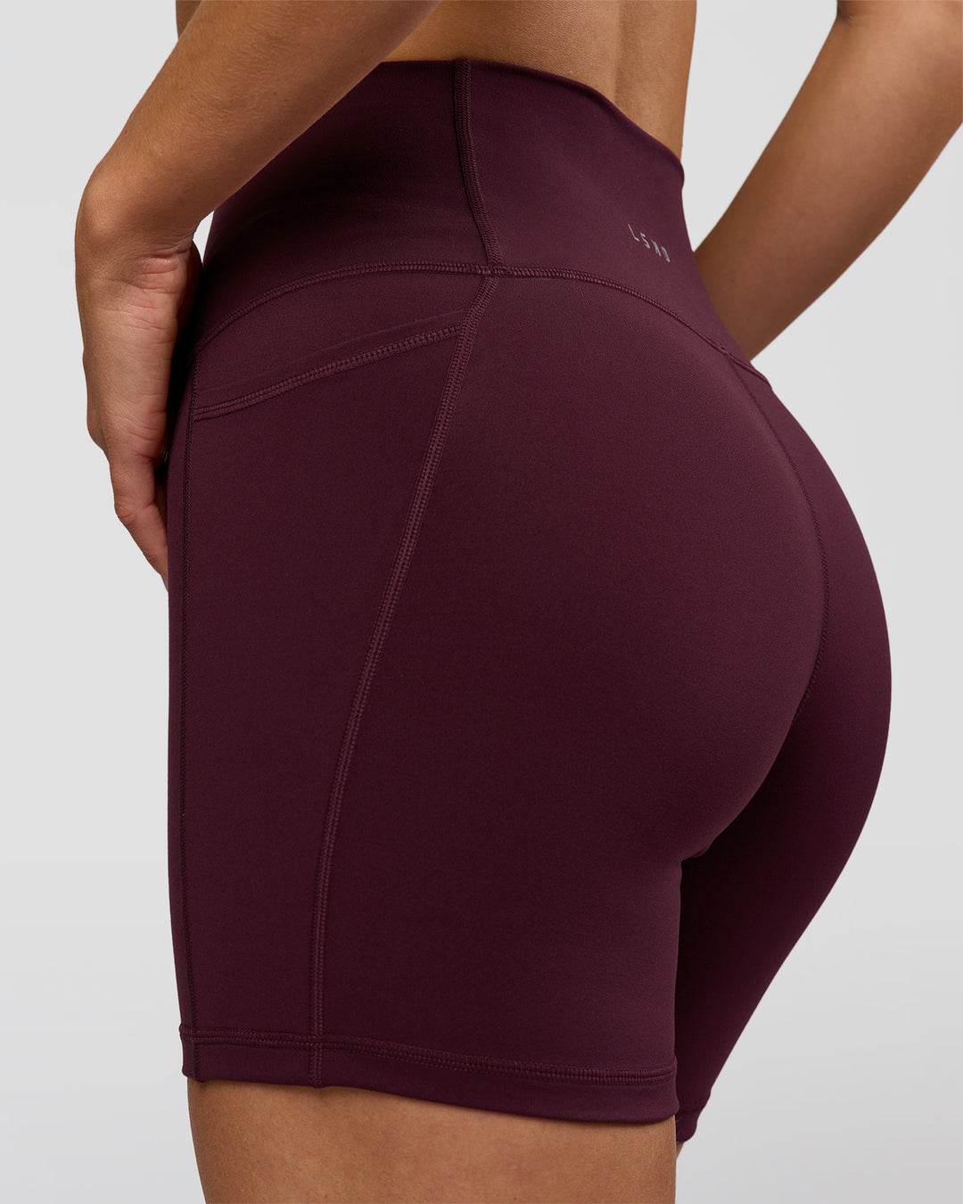 Woman wearing O.G. Fusion Ultra High-Rise 6" Short Pockets - Cherry Lacquer | Model:Amity | Size:S - view 6