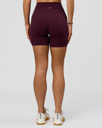 Woman wearing O.G. Fusion Ultra High-Rise 6" Short Pockets - Cherry Lacquer | Model:Amity | Size:S | Thumbnail Index: 8