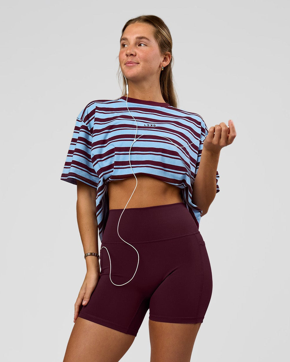 Woman wearing O.G. Fusion Ultra High-Rise 6" Short Pockets - Cherry Lacquer | Model:Amity | Size:S