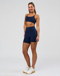 Woman wearing O.G. Fusion Ultra High-Rise 6" Short Pockets - Future Navy | Model:Amity | Size:S | Thumbnail Index: 2