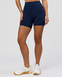 Woman wearing O.G. Fusion Ultra High-Rise 6" Short Pockets - Future Navy | Model:Amity | Size:S | Thumbnail Index: 4
